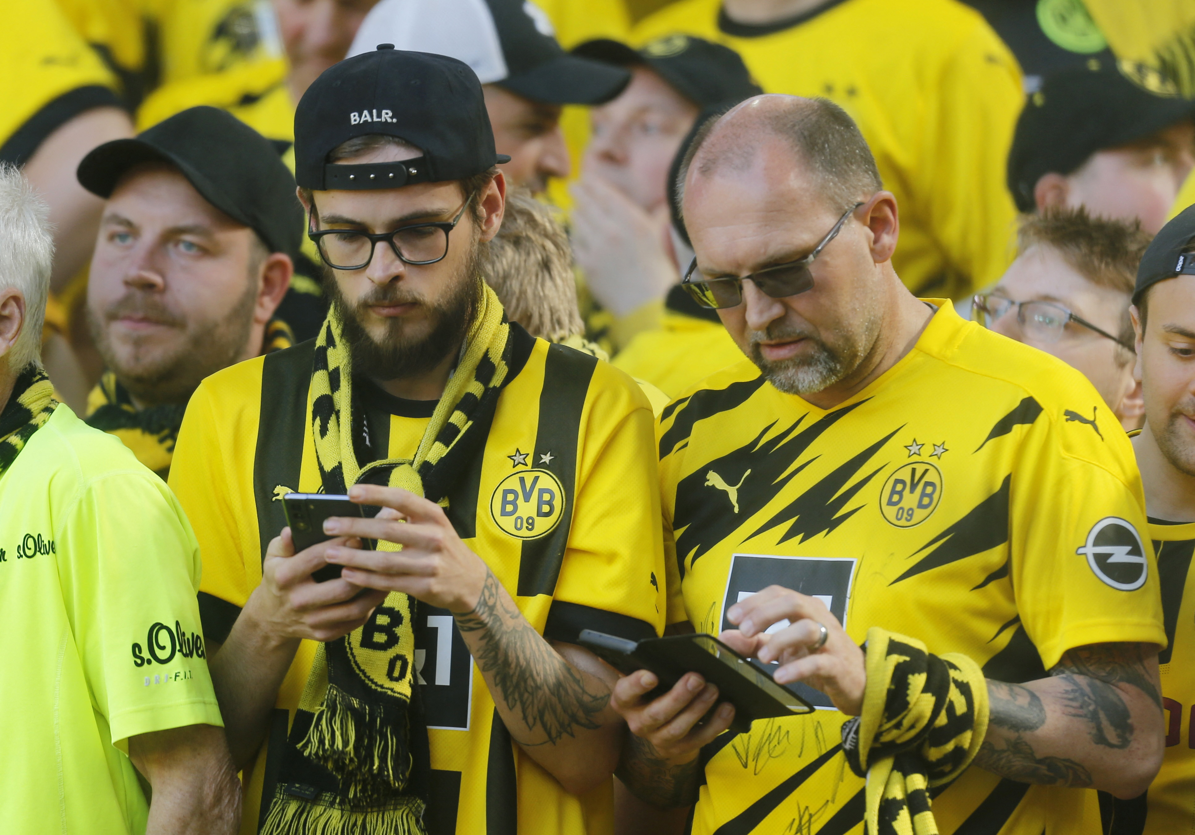 Dortmund supporters nervously checked the Bayern score