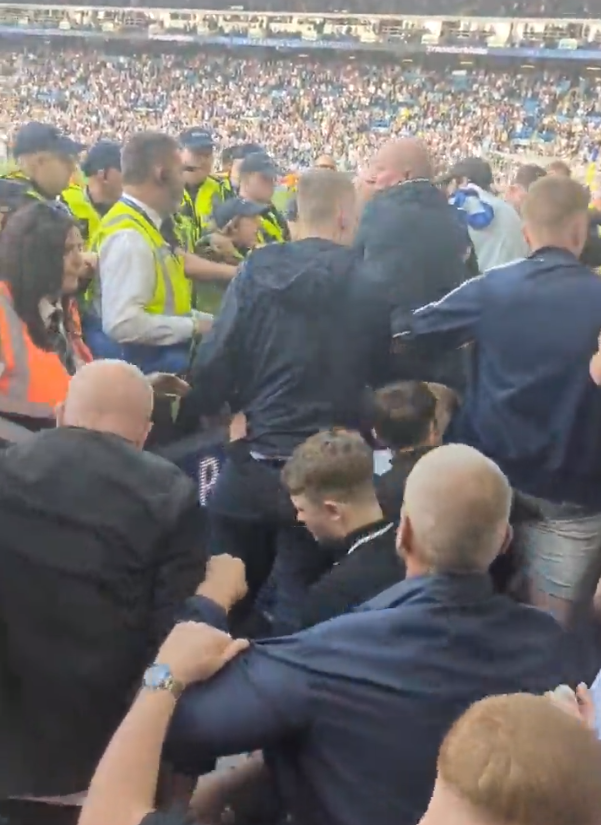 Ugly scenes explode as Leeds United fans clash with police following their relegation from the Premier League